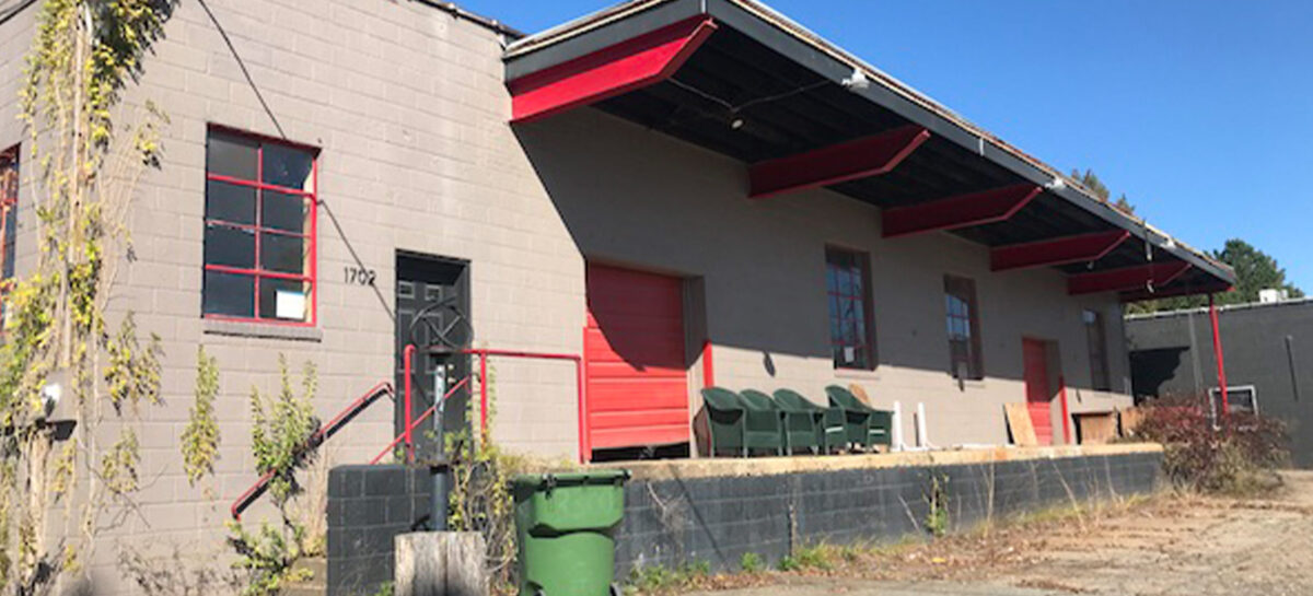 exterior photo of covered patio with grownup weeds