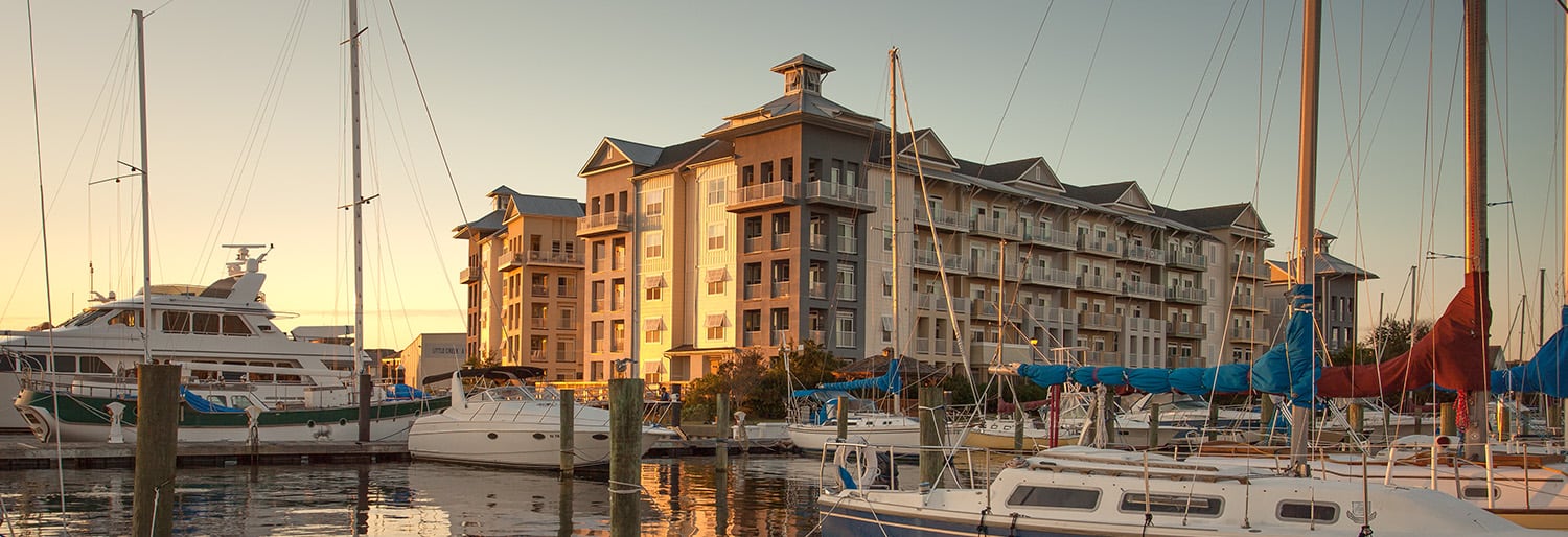 View of building beyond a dock with boats