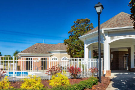 View of a fenced in pool and gazebo