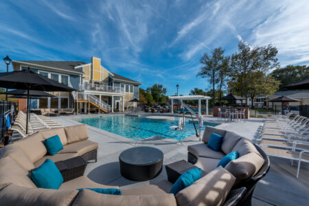 Photo of a pool and the surrounding area with sun chairs