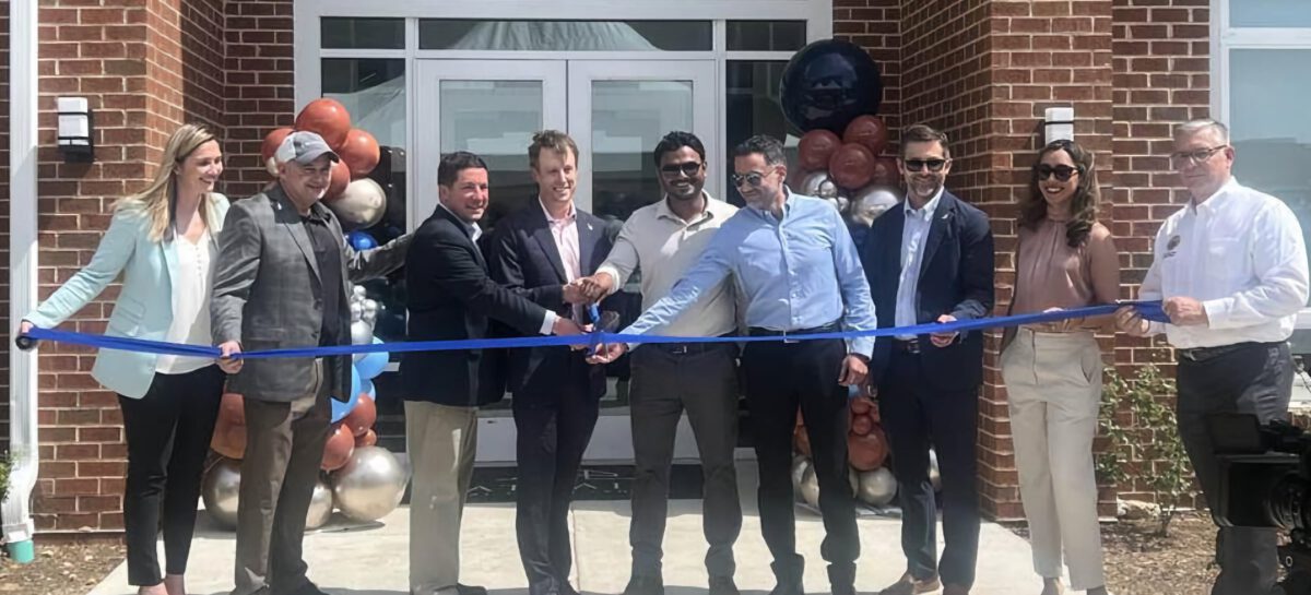 Photo of Bonaventure team at a ribbon cutting ceremony for new property